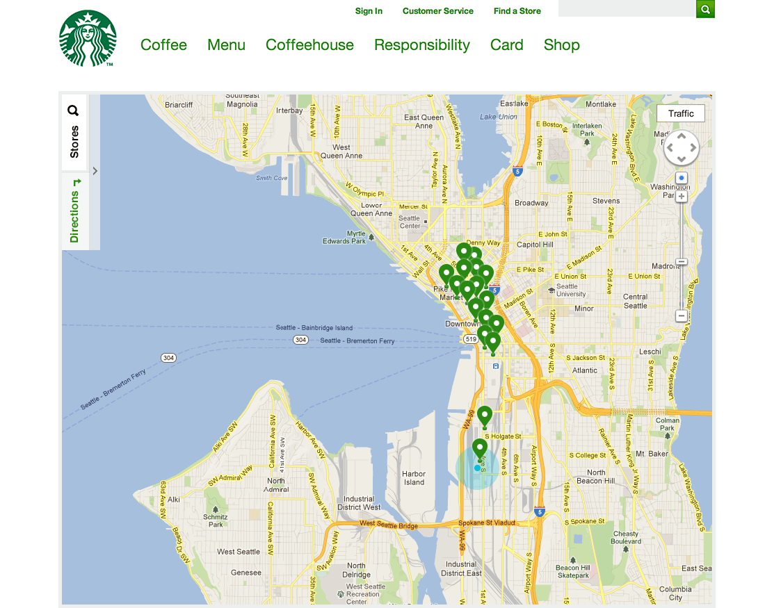 This 2012 representation of the Starbucks Store Locator is a design layout for large format display. The picture is a screenshot of the interface on a desktop computer; tab navigation to search for stores and directions on the top left, and a map with upsidedown teardrop pins at locations of interest. The entire interface was optimised for assistive technology by only announcing information that pertained to what someone was looking for and not the overabundance of data being represented on the map. Careful considerations were taken to program the interface by making keyboard navigation a must, doing so also helped with navigating using screen reader technology like VoiceOver, or JAWS.